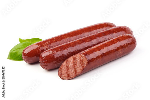 Grilled sausages with tomatoes sauce and fresh herbs, isolated on white background. photo