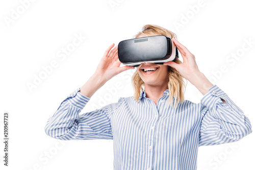smiling attractive woman using virtual reality headset isolated on white