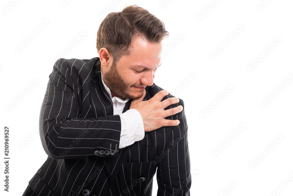 Portrait of business man showing shoulder pain gesture. Portrait of business man showing shoulder pain gesture.