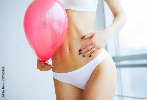 Slika na platnu Bloating. Stomach hand woman studio. Women Health.
