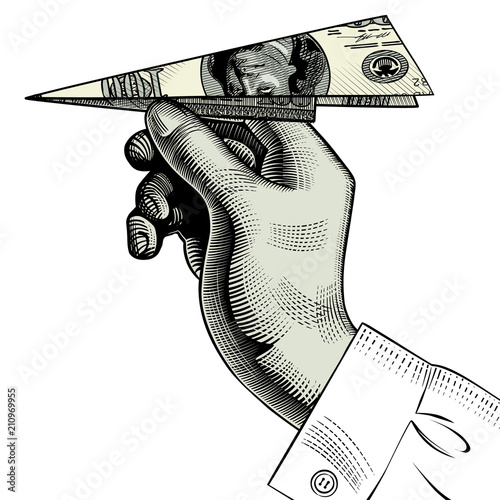 Hand with a paper plane made from a dollar bill