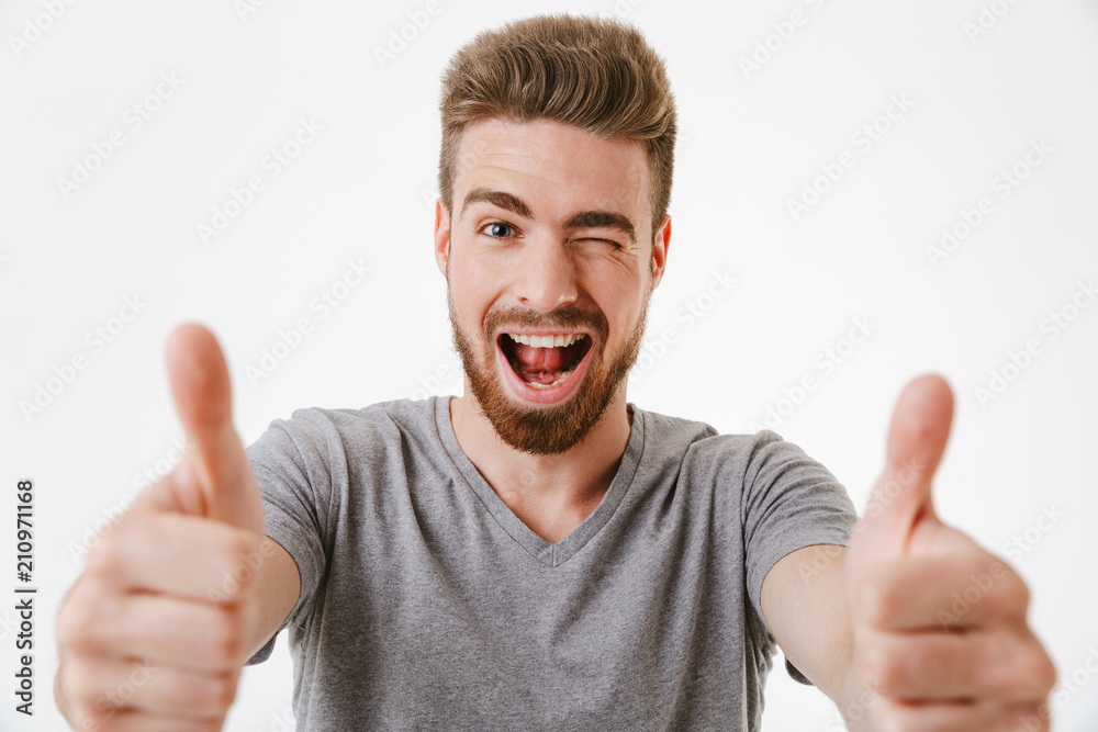 Close up portrait of a cheerful young bearded man Close up portrait of a cheerful young bearded man