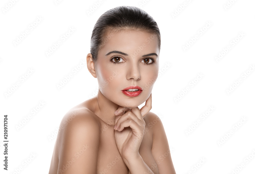 Fototapeta premium Portrait of a beautiful brunette on a white background