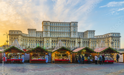 Obraz na płótnie Christmas market and decorations in center of Bucharest, Parliament building in background, Romania w salonie