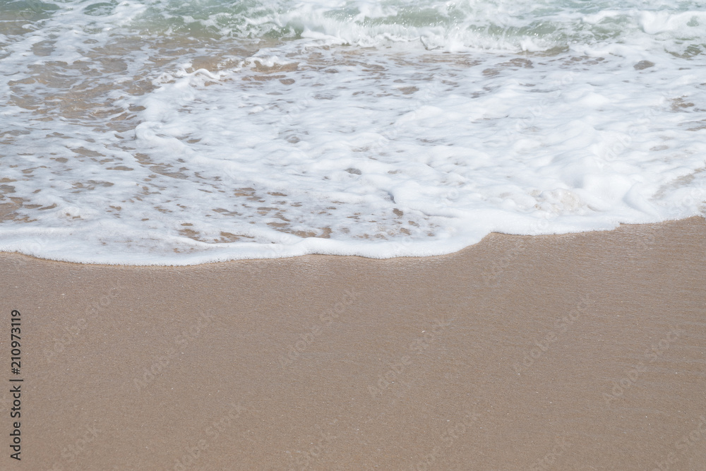 HDR shot of sea shore with wave and white sand during summer day in thailand (selective focus and white balance / color tone shift )