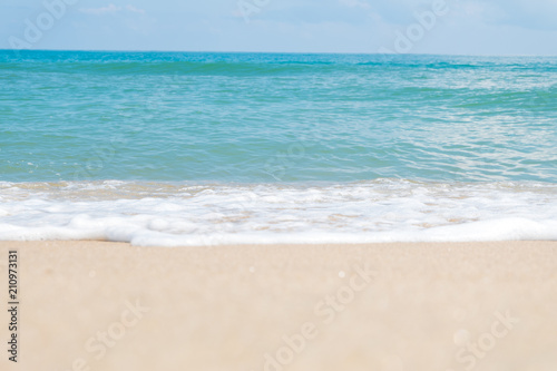 HDR shot of sea shore with wave and white sand during summer day in thailand (selective focus and white balance / color tone shift )