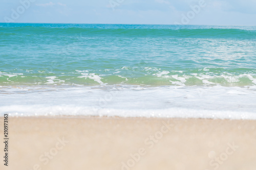 HDR shot of sea shore with wave and white sand during summer day in thailand (selective focus and white balance / color tone shift )