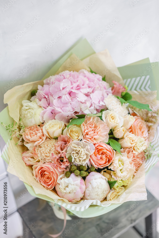 beautiful spring bouquet. flower arrangement with hydrangea and peonies. Color light pink. The concept of a flower shop, a small family business beautiful spring bouquet. flower arrangement with hydrangea and peonies. Color light pink. The concept of a flower shop, a small family business