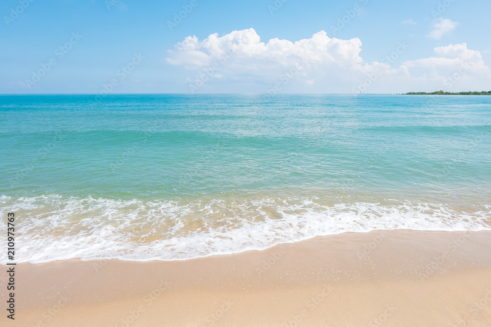 HDR shot of sea shore with wave and white sand during summer day in thailand (selective focus and white balance / color tone shift )