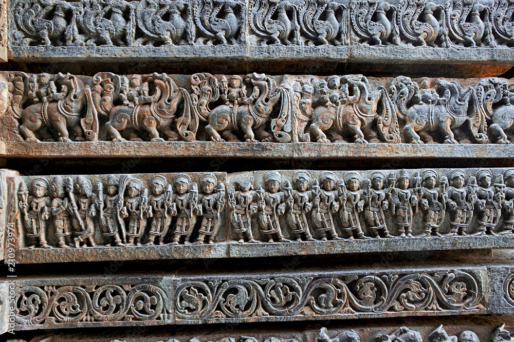 Friezes of animals, scenes from mythological episodes from Ramayana and Mahabharata, at the base of temple, Hoysaleshwara temple, Halebidu, Karnataka