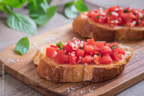 Bruschetta with chopped tomato and basil on toast
