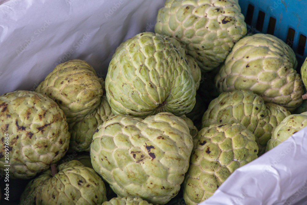 Custard apple fruit for sale in the fresh market,common name The sugar-apple or sweetsop. Custard apple fruit for sale in the fresh market,common name The sugar-apple or sweetsop.