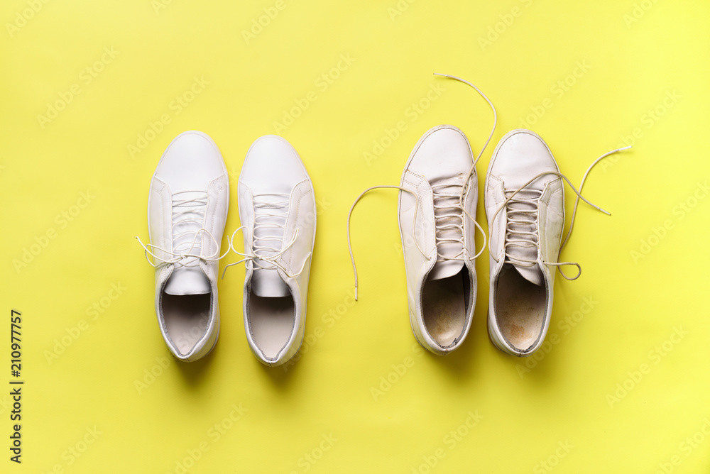 Old dirty sneakers vs new white sneakers on yellow background. Trendy  footwear. Top view. Concept of experience, discipline and chaos, accuracy \  mess, stylish shoes. Back to school Stock Photo | Adobe Stock
