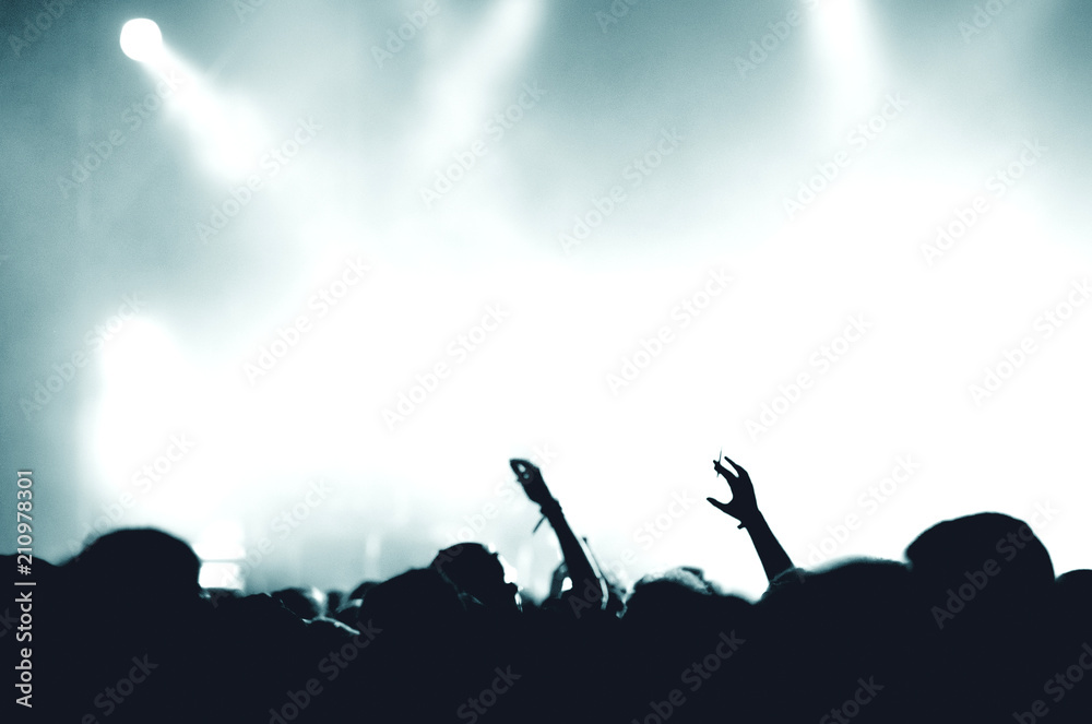 Concert crowd, stage lights, space for text