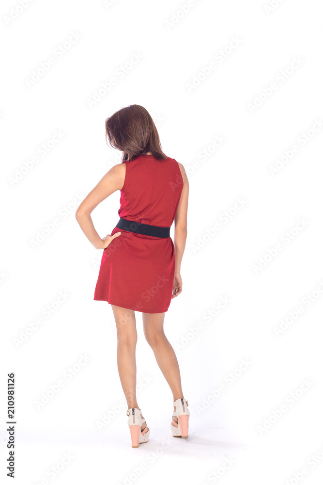 beautiful asian girl in red dress in a studio shot on white background (with selective focus) beautiful asian girl in red dress in a studio shot on white background (with selective focus)