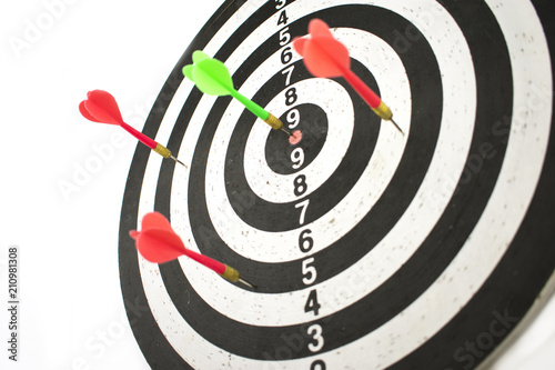 dart board and javelin in target
