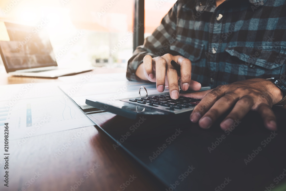 Close up view of bookkeeper or financial inspector hands making report, calculating or checking balance. Home finances, investment, economy, saving money or insurance concept Close up view of bookkeeper or financial inspector hands making report, calculating or checking balance. Home finances, investment, economy, saving money or insurance concept