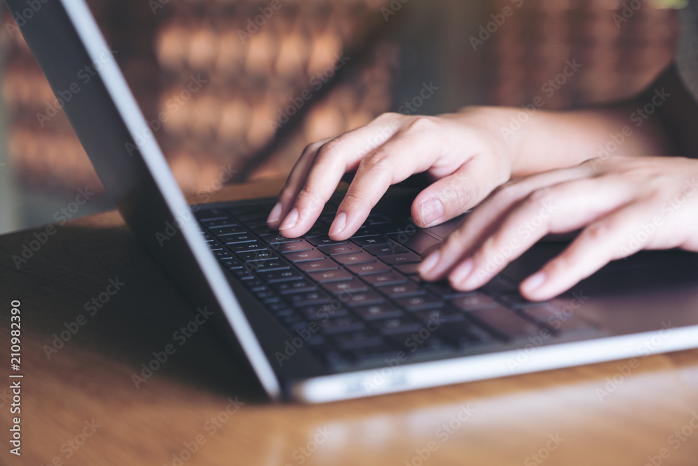 Closeup image of hands working and typing on laptop keyboard in office Closeup image of hands working and typing on laptop keyboard in office