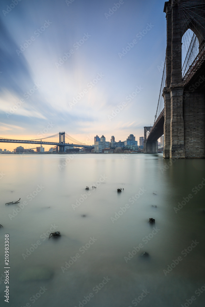 view on Brooklyn and Manhattan bridges from the broken pier during sunrise
