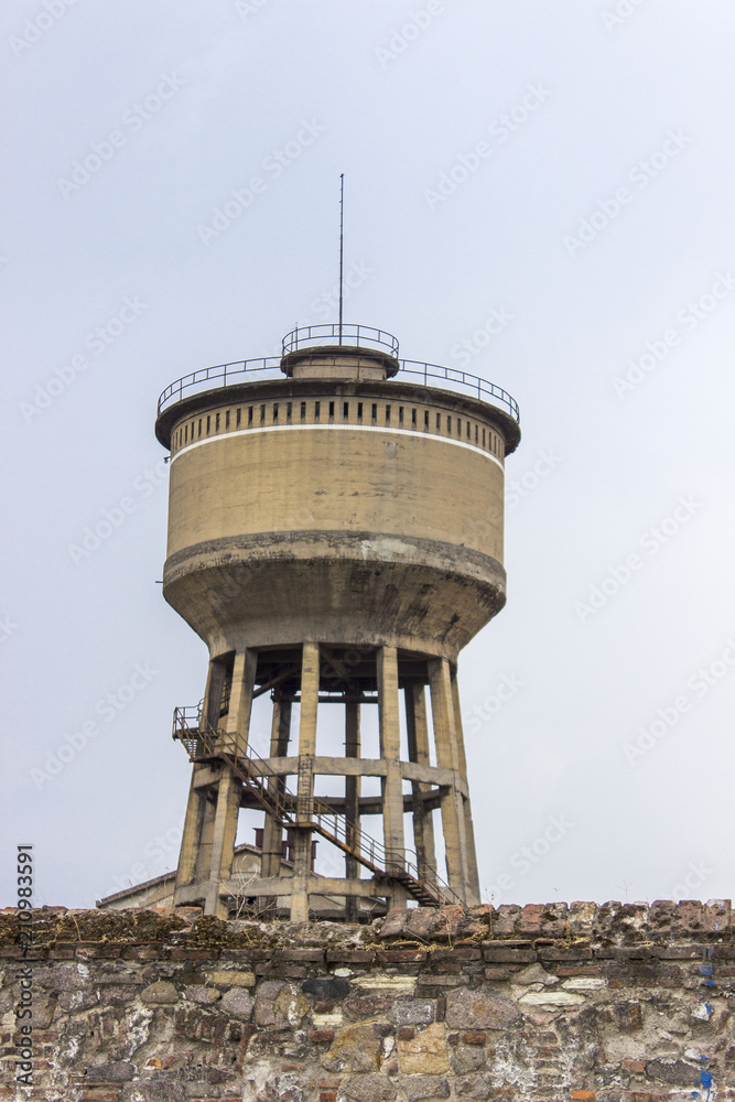 Vertical close-up shot of old reinforced pale yellow colored concrete water tank in Izmir at Turkey Vertical close-up shot of old reinforced pale yellow colored concrete water tank in Izmir at Turkey