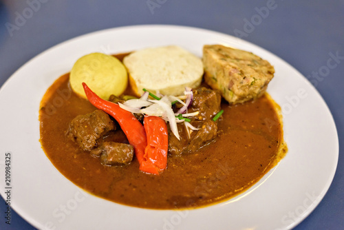 Beef stew with sauce and red chili pepper photo