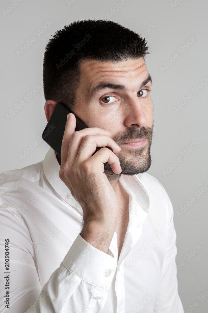 Portrait of young handsome businessman talking on mobile phone Portrait of young handsome businessman talking on mobile phone