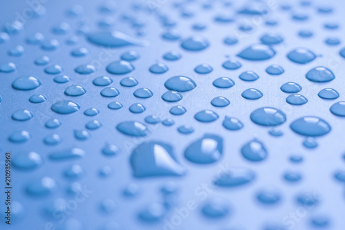 Water droplets on blue background