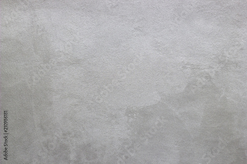 Abstract texture of decorative plaster. Grunge background of stucco texture. Gray painted surface.