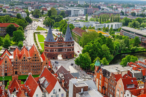 Old German town of Lubeck. Old historic city in Germany. Panorama of small town. Top view on Holsten Gate. Top view.  June 2017.