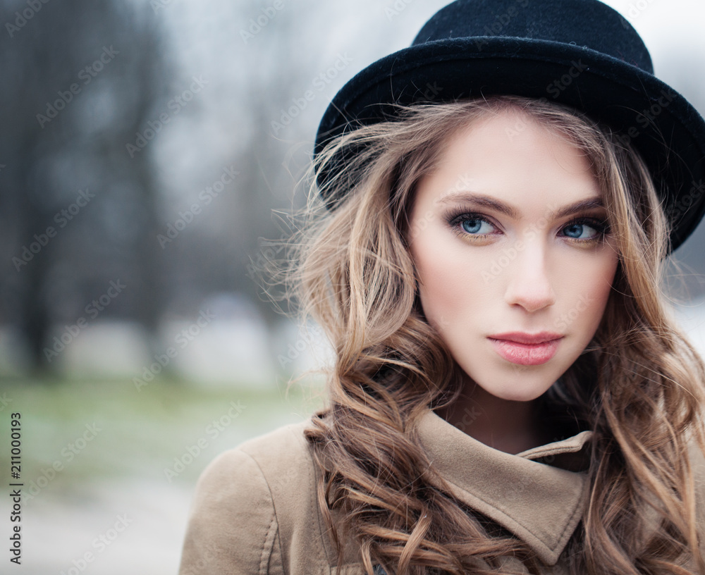 Cute young woman in hipster hat outdoors. Perfect female face, closeup portrait Cute young woman in hipster hat outdoors. Perfect female face, closeup portrait