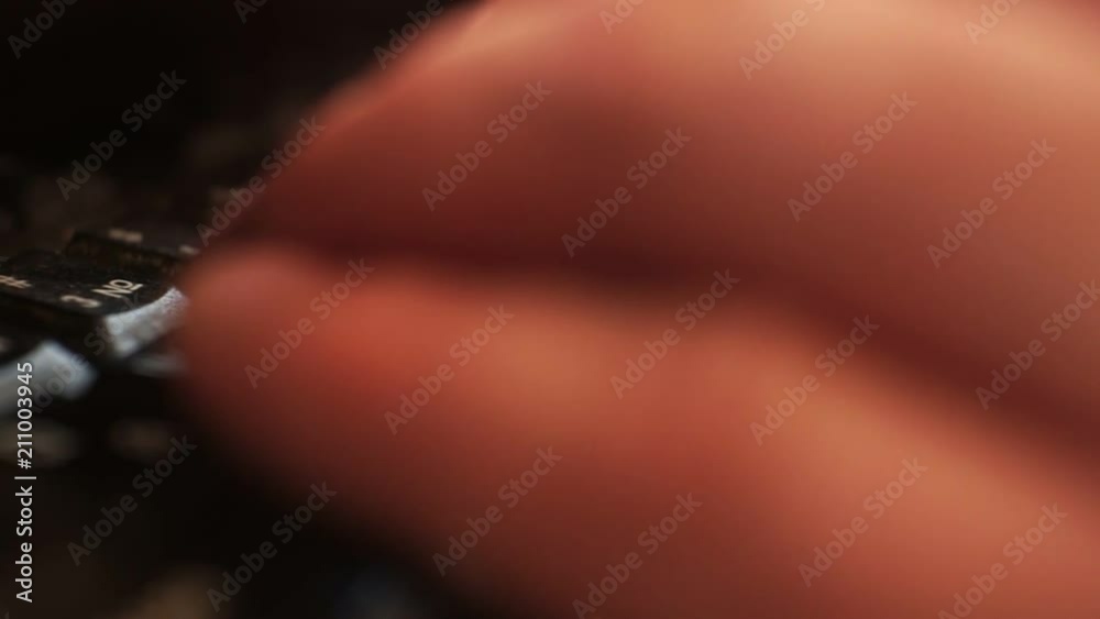 fingers on a computer keyboard closeup.shallow depth of field.
