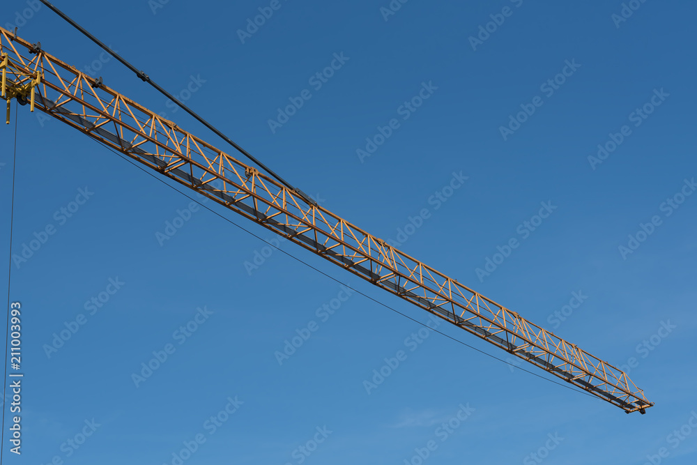 Tower Crane in the clouds and blue sky. Tower Crane in the clouds and blue sky.