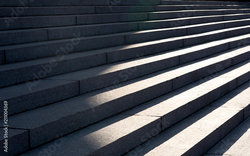 Horizontal view of shadows projected on the granite stairs photo