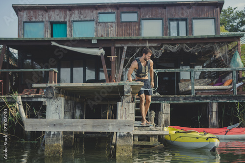 Kayaker Standing on Deck © LStockStudio