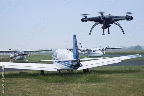 Fototapeta Naklejka Na Ścianę i Meble -  The drone in flight with signal lights produces video and photography of the neighborhood