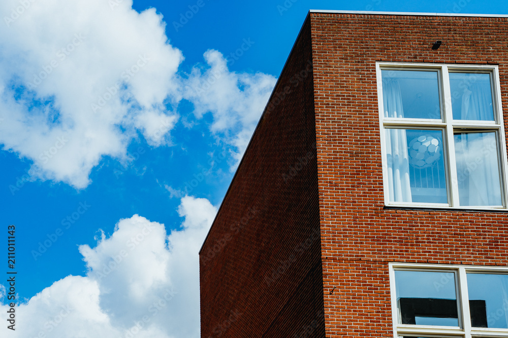 Simple brick building with a blue sky in the background