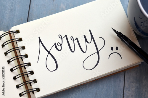 SORRY hand-lettered in notepad