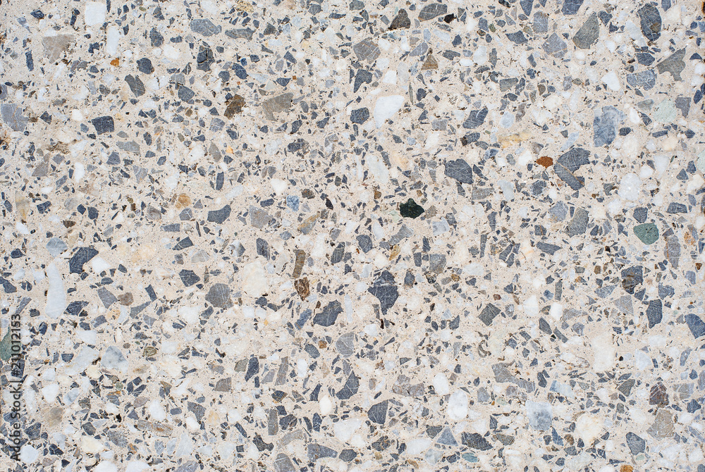 The texture background of a light granite tile interspersed with stone for design. Granite slab, marble texture The texture background of a light granite tile interspersed with stone for design. Granite slab, marble texture