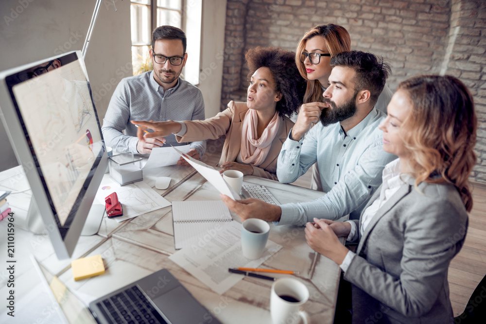 © ivanko80 - Business people sitting at corporate meeting