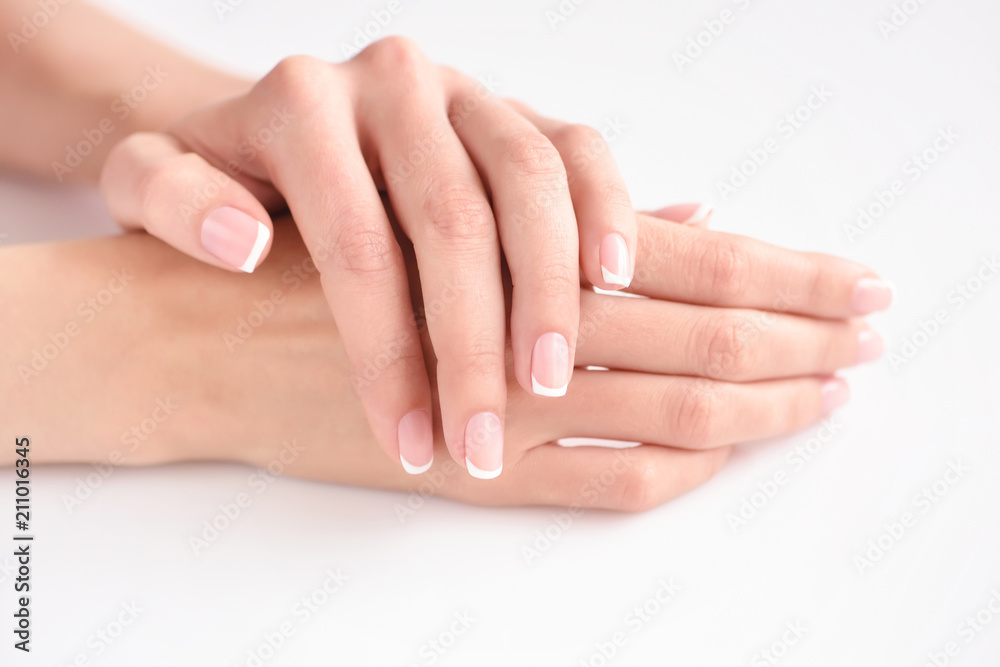 Beautiful woman hands with french manicure Beautiful woman hands with french manicure