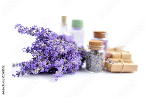 Fototapeta Naklejka Na Ścianę i Meble -  Spa products and lavender flowers on a white background