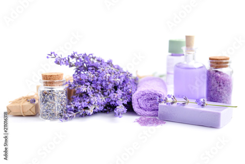Spa composition with flowers of lavender, cream, salt and soap on white background