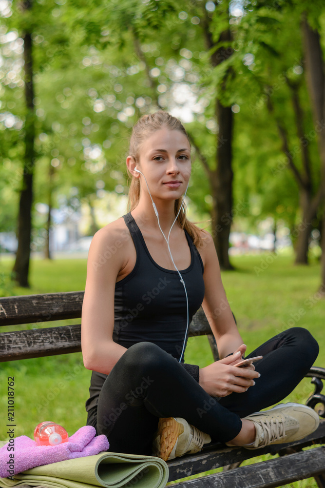 Young sexy girl exercise sitting in park Young sexy girl exercise sitting in park