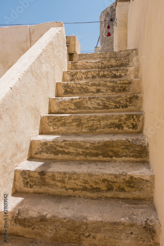 Stone steps leading up to the roof of a traditional Maltese house. photo