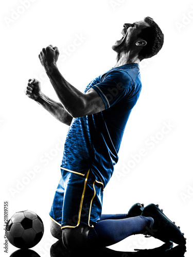 one caucasian soccer player man happy celebration in silhouette isolated on white background