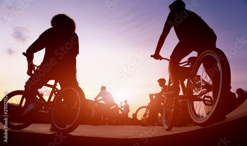 Fototapeta Naklejka Na Ścianę i Meble -  bicyclists on the ramp for jumping