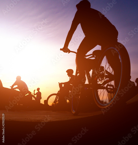 bicyclists on the ramp for jumping