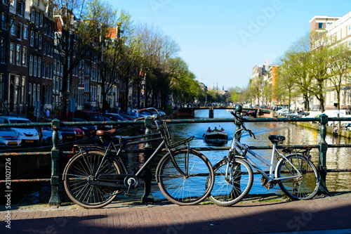 Traditional dutch bicycles parked on the bridge in Amsterdam, th