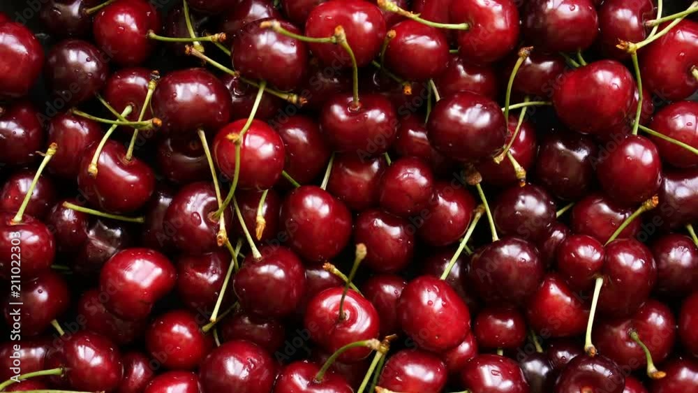 Background top view 4k video of ripe cherries rotating Background top view 4k video of ripe cherries rotating