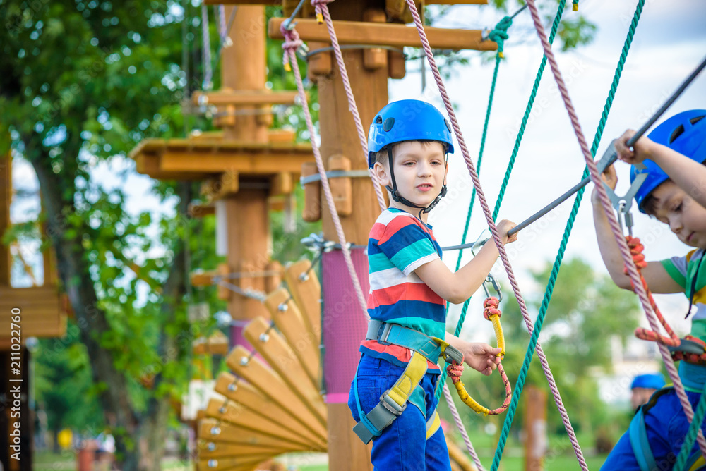 Young boy playing and having fun doing activities outdoors. Happiness and happy childhood concept Young boy playing and having fun doing activities outdoors. Happiness and happy childhood concept